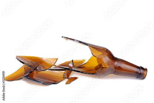 Shattered brown beer bottle isolated on the white background