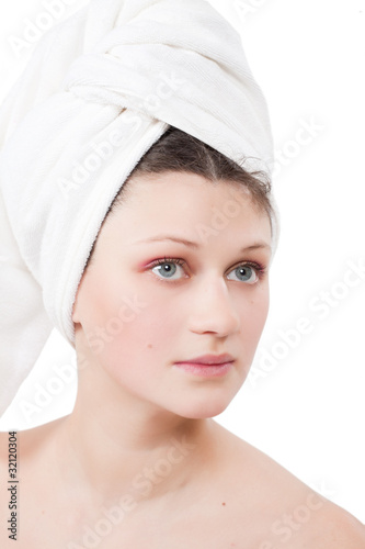 Portrait of the girl in a white towel after bath acceptance