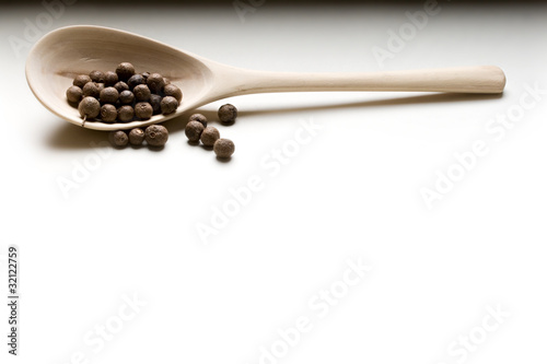 Wooden spoon and pepper