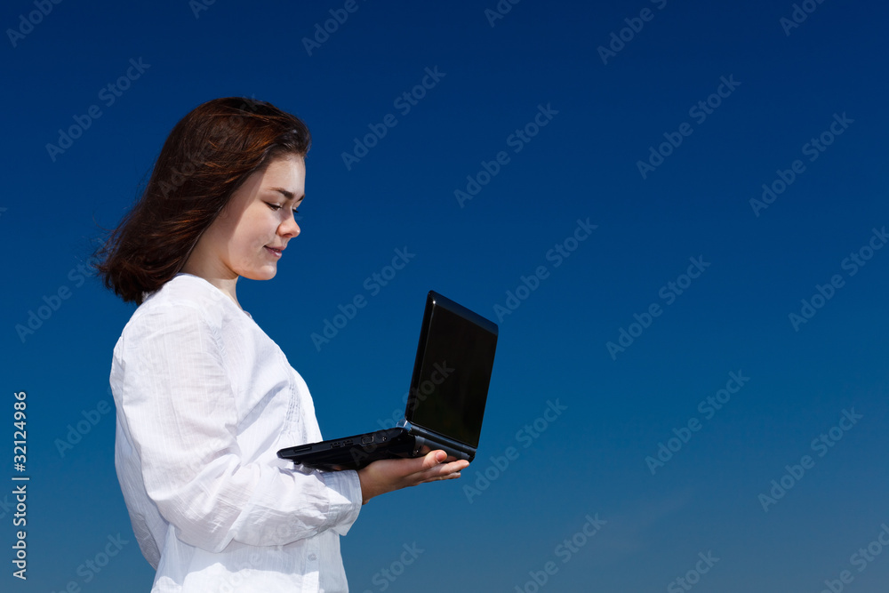 Girl using laptop outdoor Girl using laptop outdoor