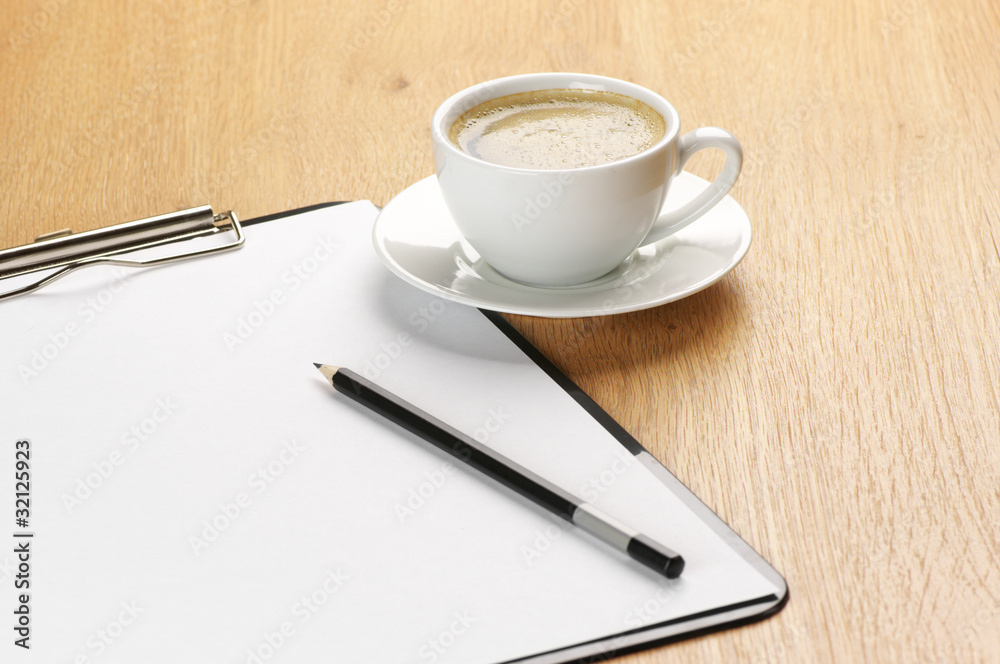 Clipboard and coffee