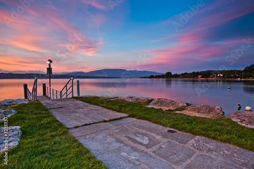 Sunrise over Lake Geneva, Versoix, Switzerland photo