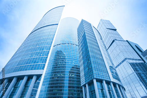 futuristic structure of office skyscrapers in the morning  wide