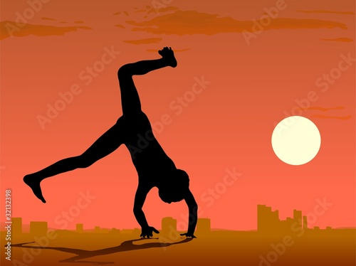 boy somersault against sunset