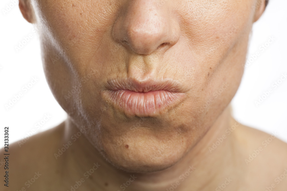 Obraz premium Woman pouting, white background.