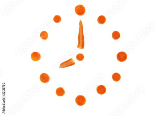 Clock made of carrots slices