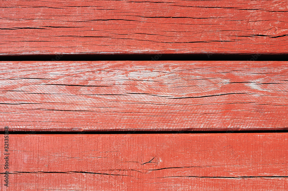 Red painted threadbare wooden plank Red painted threadbare wooden plank