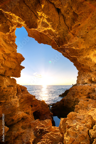 Sunset into grotto photo