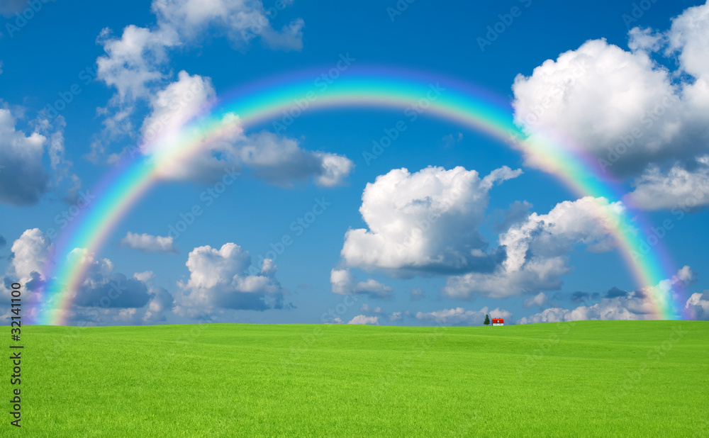 Green grass and red roof house and rainbow Green grass and red roof house and rainbow