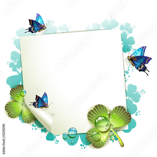 Sheet of paper and clover over springtime background
