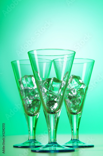 Glasses of water against gradient background