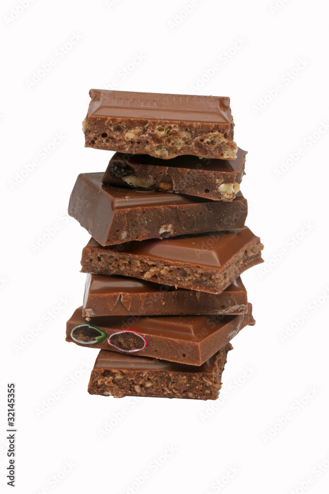 Close up of chocolate pieces on white background Close up of chocolate pieces on white background