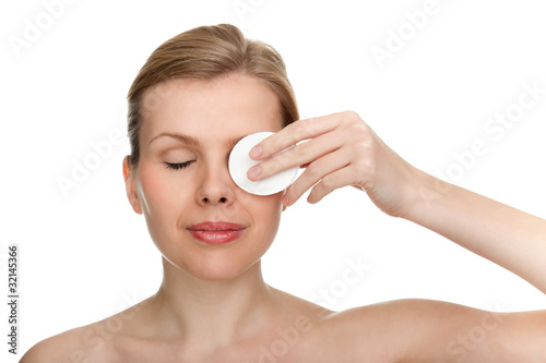 Canvas Print woman using a makeup remover pad