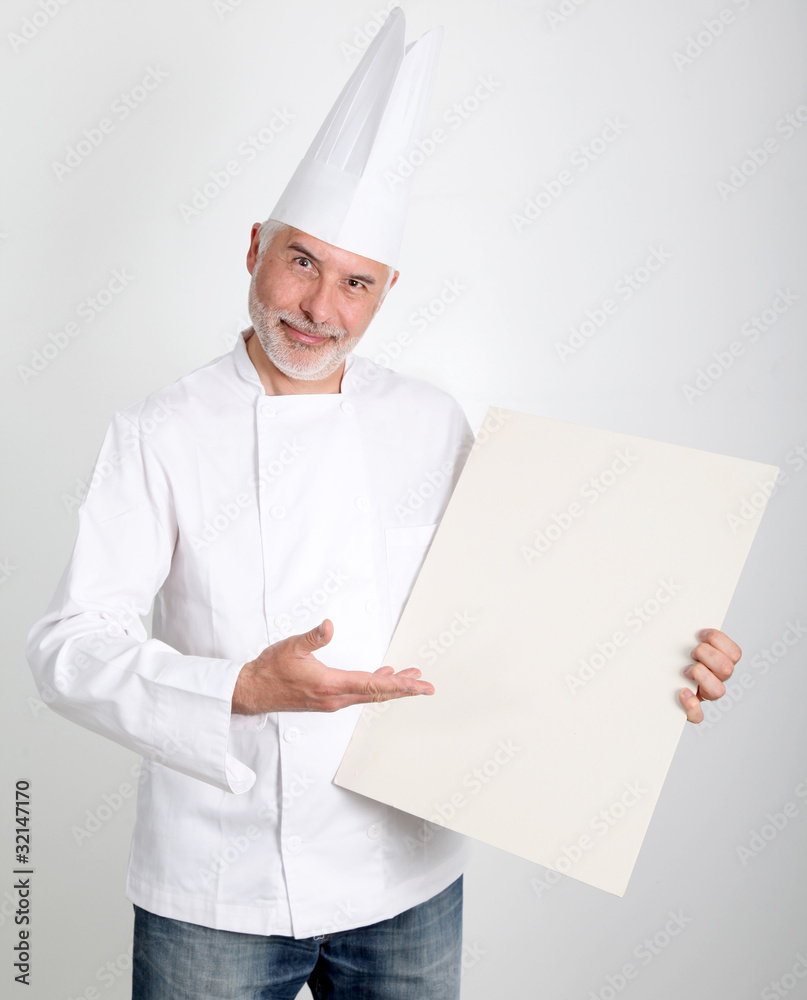 Smiling chef showing restaurant menu Smiling chef showing restaurant menu