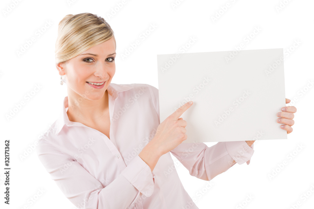 Happy businesswoman pointing aside at empty banner Happy businesswoman pointing aside at empty banner