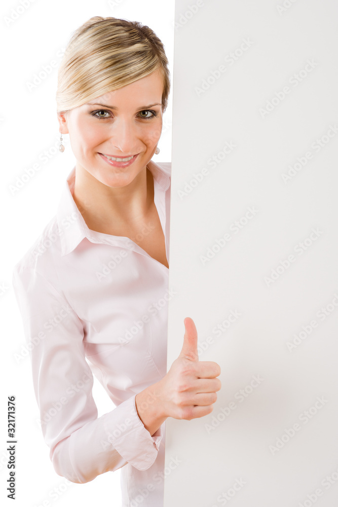Happy businesswoman behind empty banner thumbs up Happy businesswoman behind empty banner thumbs up