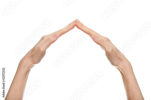 female hands forming a roof shape