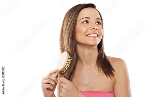 Lovely woman with hairbrush