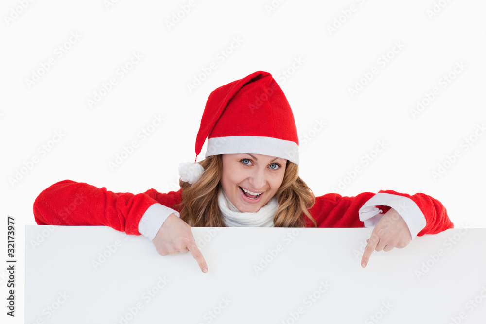 Attractive blond-haired woman dressed as Santa Claus Attractive blond-haired woman dressed as Santa Claus
