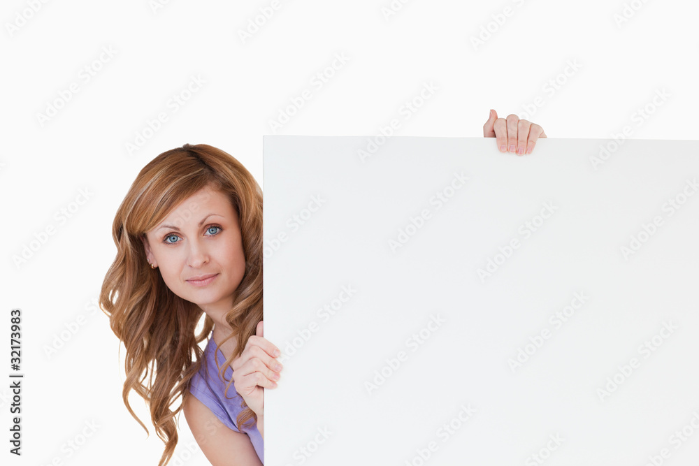 Cute blond-haired woman holding a white board Cute blond-haired woman holding a white board