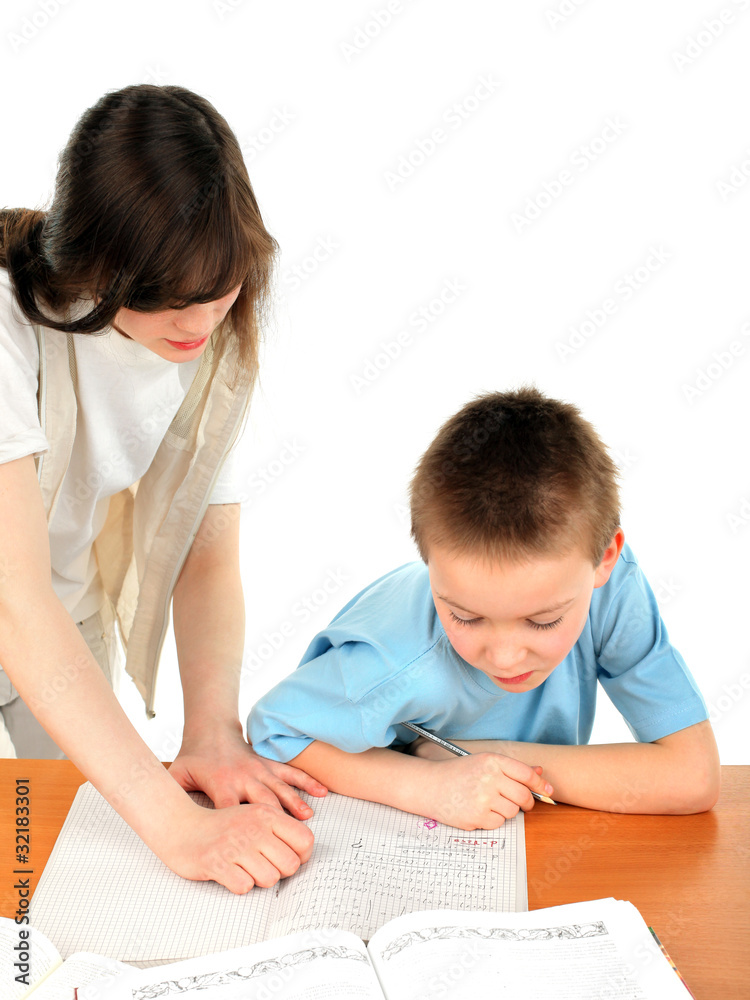 teenage girl and schoolboy on the table with exercise books teenage girl and schoolboy on the table with exercise books