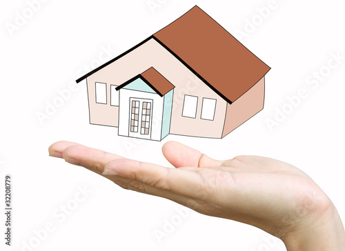 hand with model house - home concept