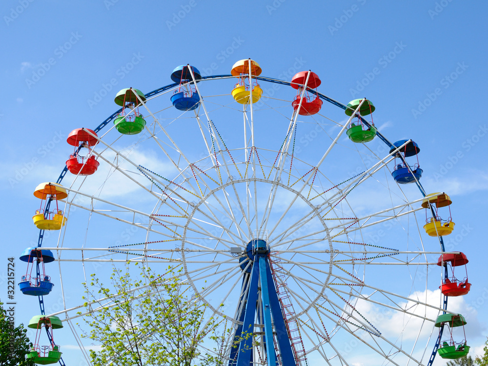 Ferris wheel on blue sky background Ferris wheel on blue sky background