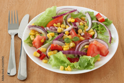 Vegetable salad with corn and red onion