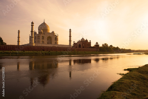 Sunset at the Taj Mahal reflected in the Yamuna River.