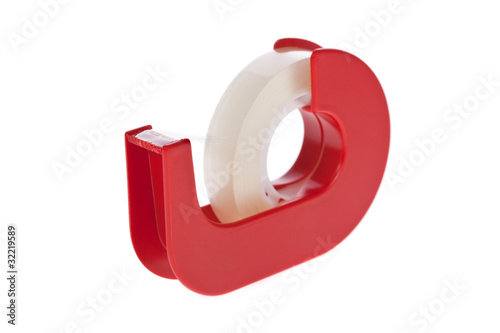 Clear tape dispenser isolated on a white background.