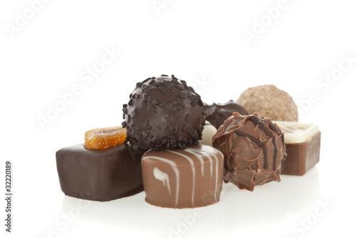 Gourmet chocolate bonbons isolated on white background. photo