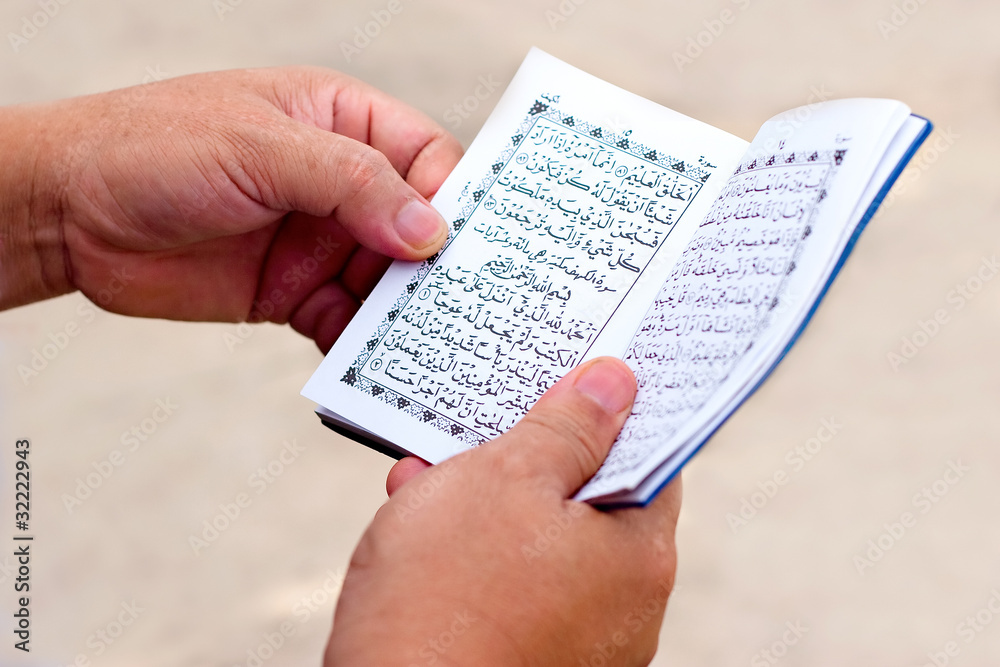 Fototapeta premium Man Reading Yassin From The Islamic Holy Quran