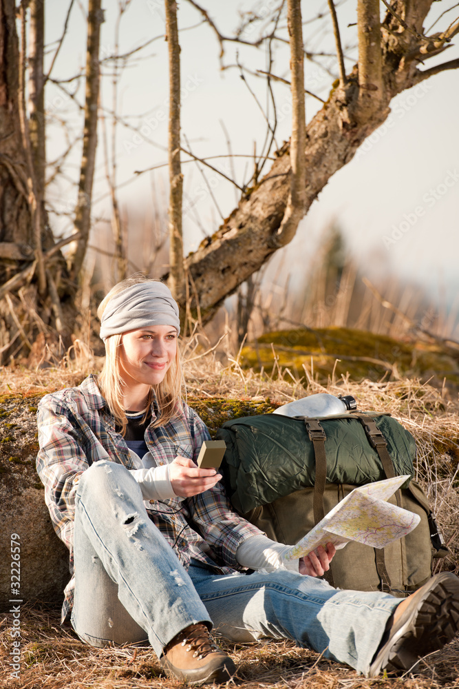 Obraz premium Camping young woman search navigation compass map in countryside