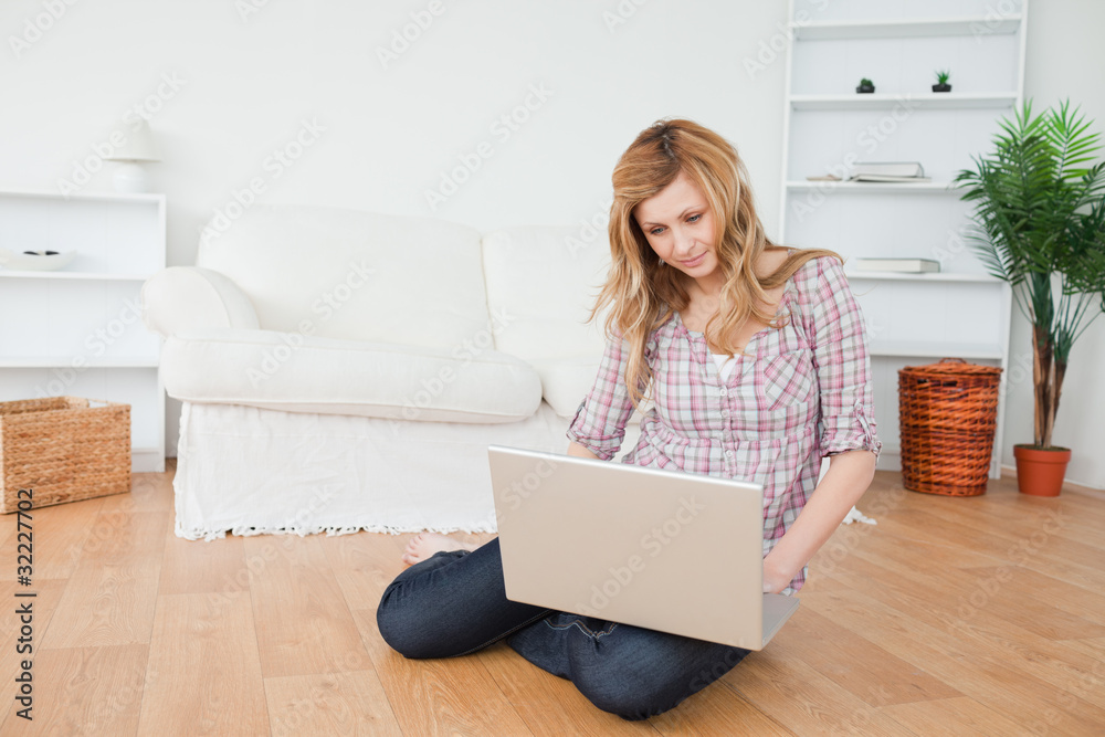 Blond-haired woman surfing on her laptop Blond-haired woman surfing on her laptop