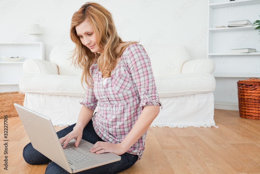 Attractive woman surfing on her laptop Attractive woman surfing on her laptop