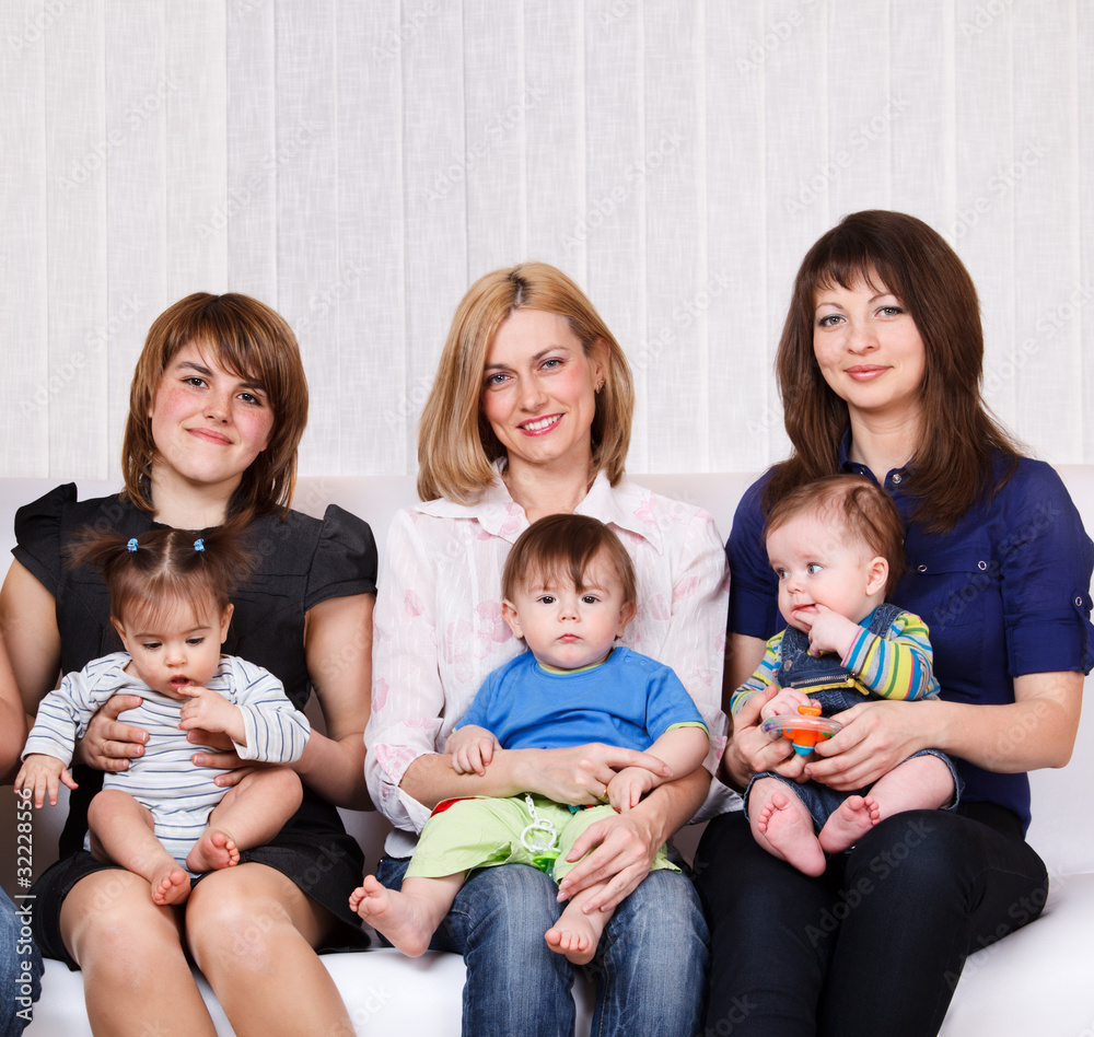 Women sitting with babies