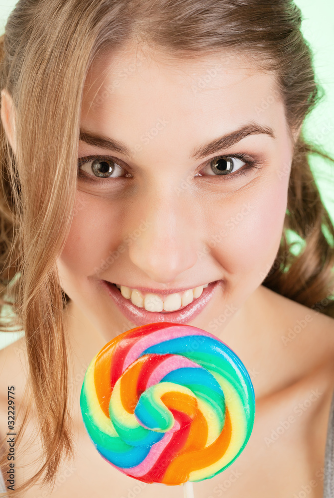 Teenager girl with lollipop