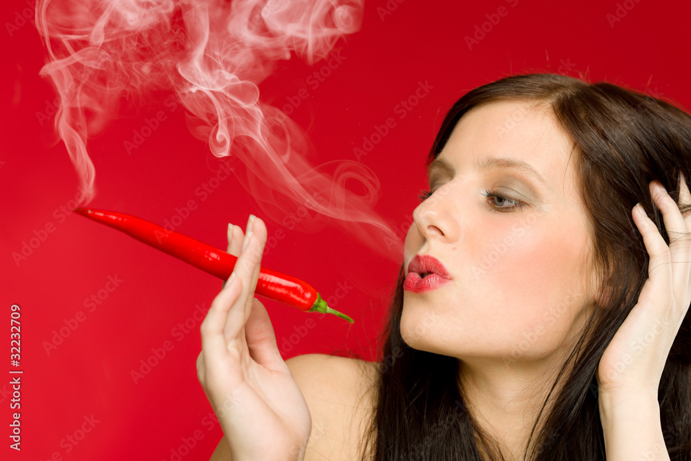 Obraz premium Chili pepper portrait young woman smoke red hot