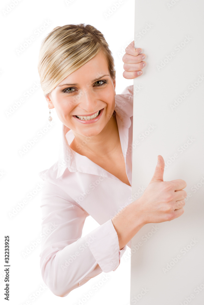 Happy businesswoman behind empty banner thumbs up Happy businesswoman behind empty banner thumbs up