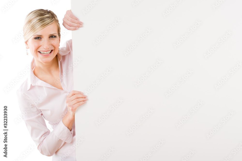Happy businesswoman behind empty banner landscape Happy businesswoman behind empty banner landscape