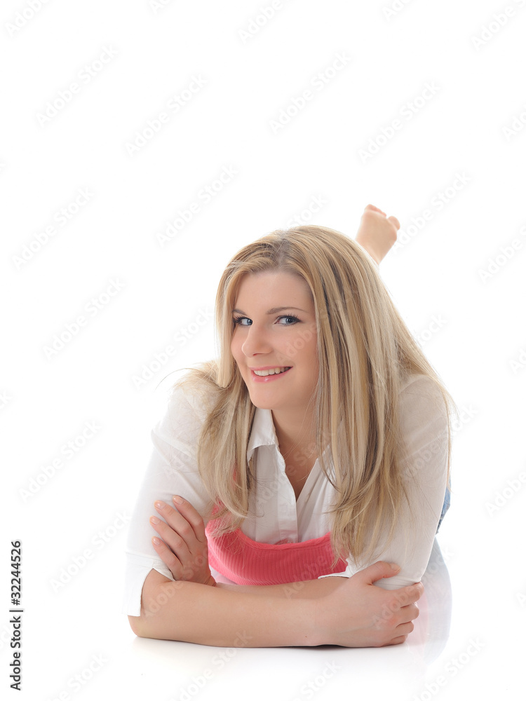 young casual smiling woman lying on the floor isolated on white young casual smiling woman lying on the floor isolated on white