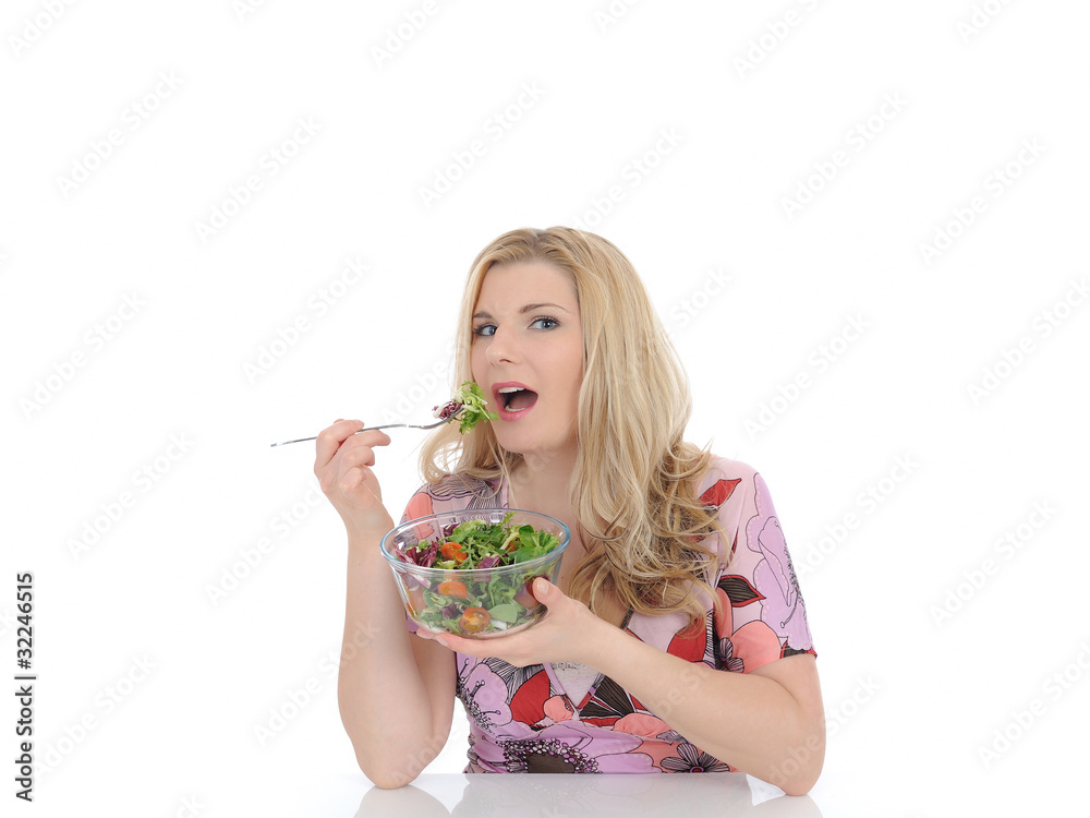 beautiful woman eating green vegetable salad. isolated on white beautiful woman eating green vegetable salad. isolated on white