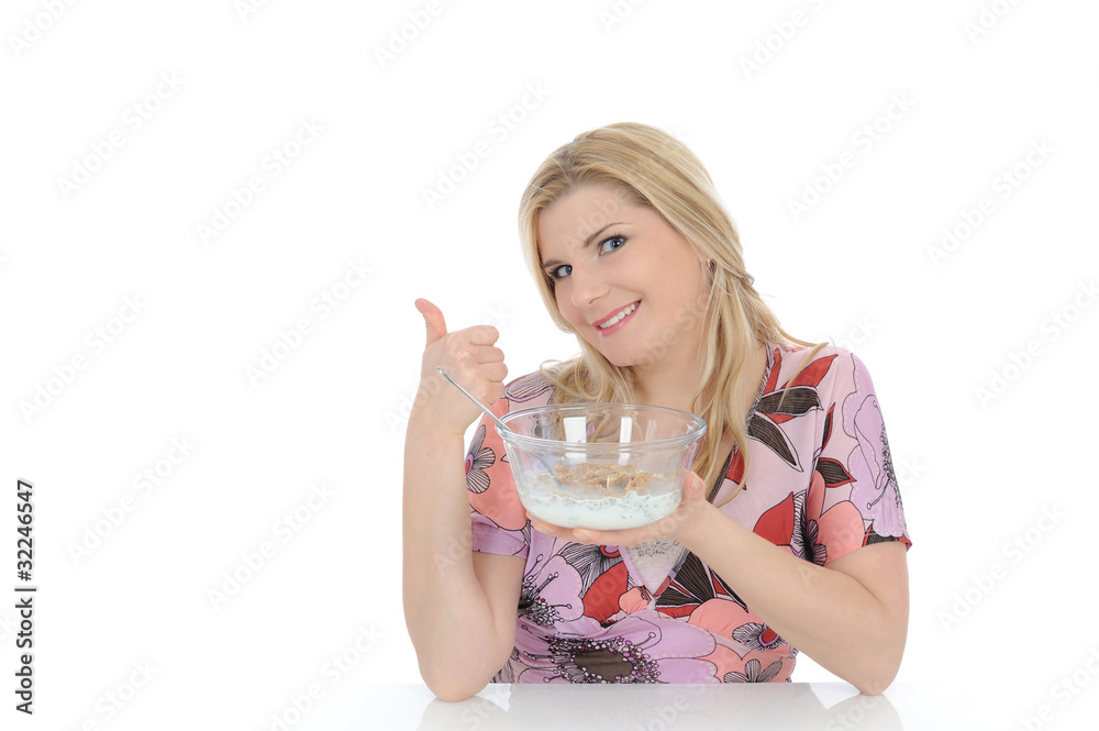 beautiful female having muesli cereals for breakfast. isolated o