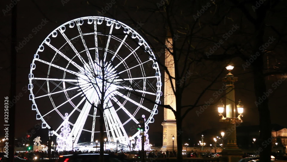 Lighted Ferris wheel, Luxor obelisk and road at Champs Elysees Lighted Ferris wheel, Luxor obelisk and road at Champs Elysees