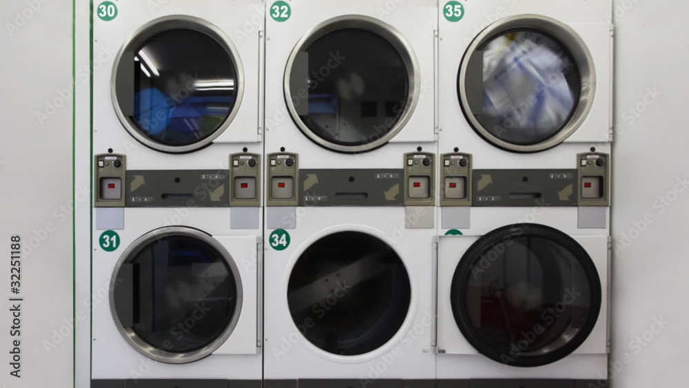 washing machines in public laundry, one of them spinning reel washing machines in public laundry, one of them spinning reel