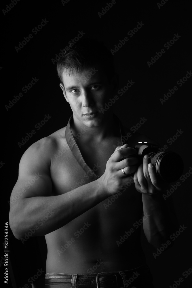 A man with a camera. A man with a camera.