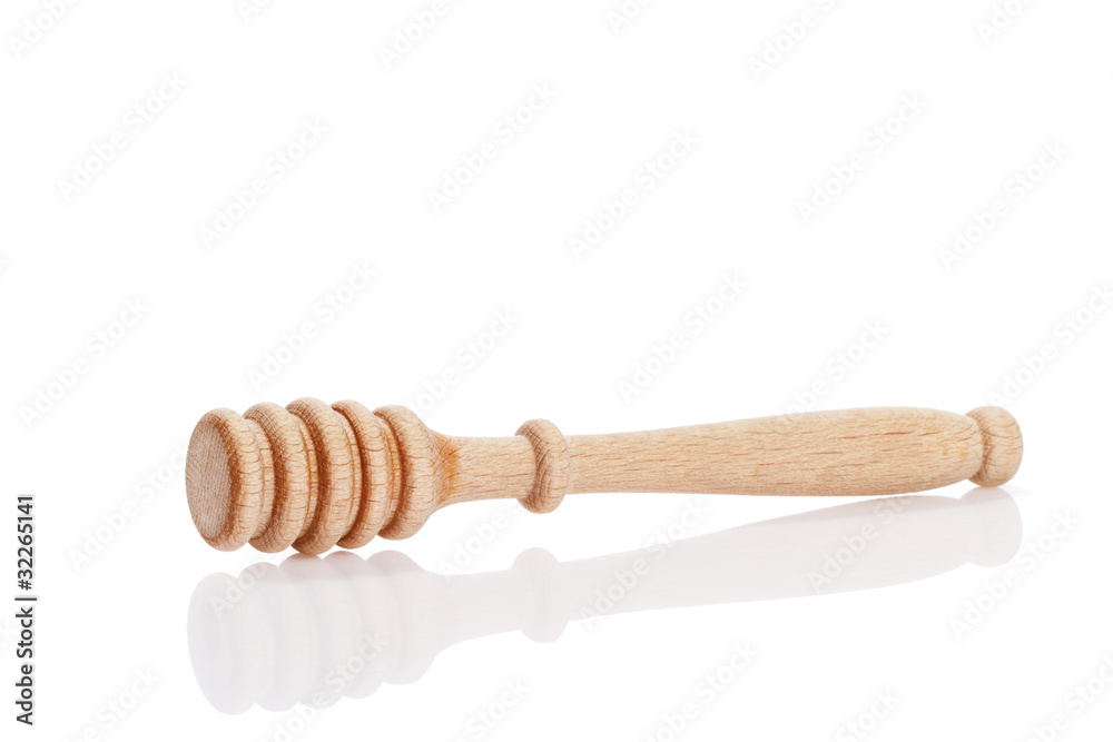 honiglöffel auf weissem hintergrund honiglöffel auf weissem hintergrund