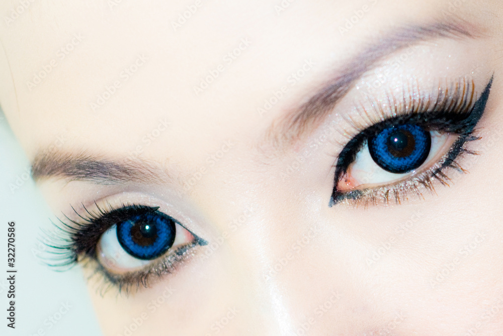 woman blue color eyes closeup woman blue color eyes closeup