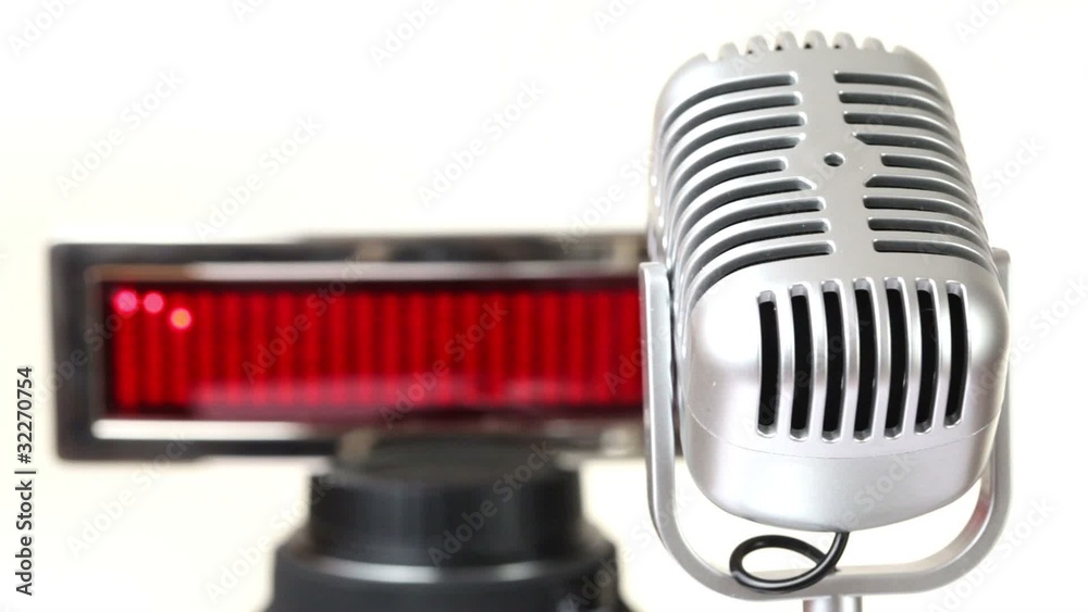 microphone rotates in front of panel with run string MUSIC