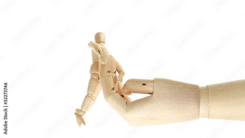 rotation of wooden toy giant arm with little toy man outside rotation of wooden toy giant arm with little toy man outside